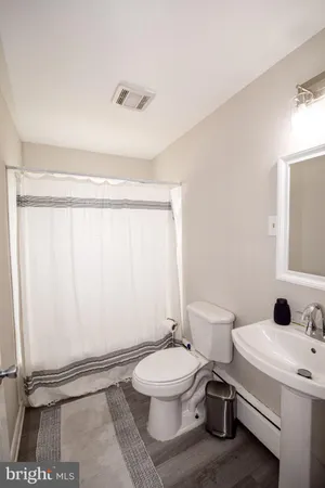 a view of a studio with wooden floor