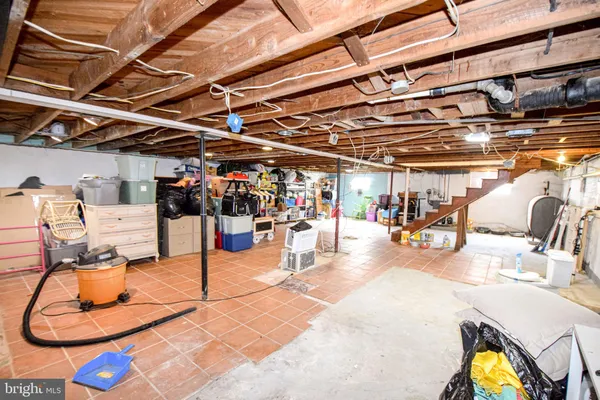 a view of a house with a chairs and table in a patio