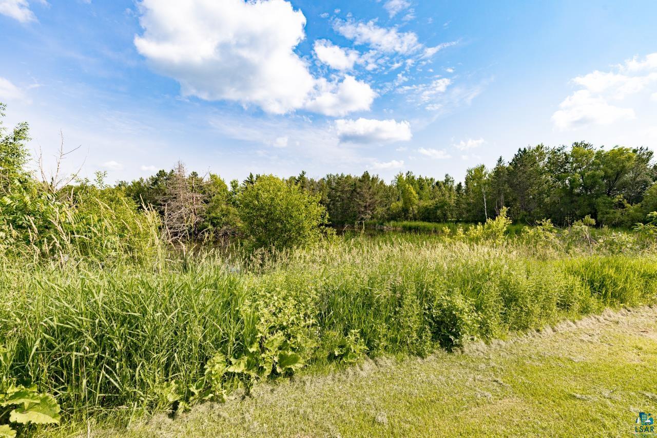 4800 Tower Road Moose Lake, MN 55767 - Photo 48 of 83 Expansive green space featuring natural foliage and a treeline horizon