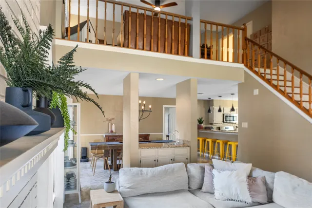 a living room with furniture and a potted plant