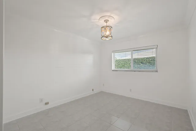 a bathroom with a granite countertop sink a toilet and bathtub