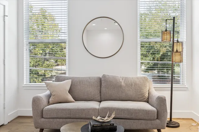 a living room with furniture and a rug