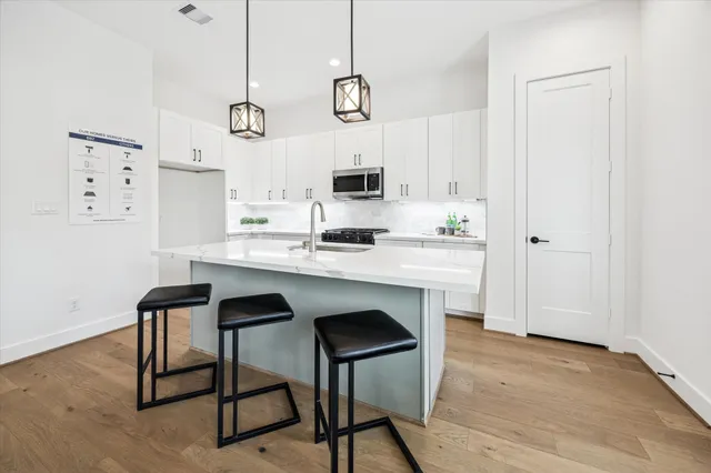 a kitchen with a table and chairs in it