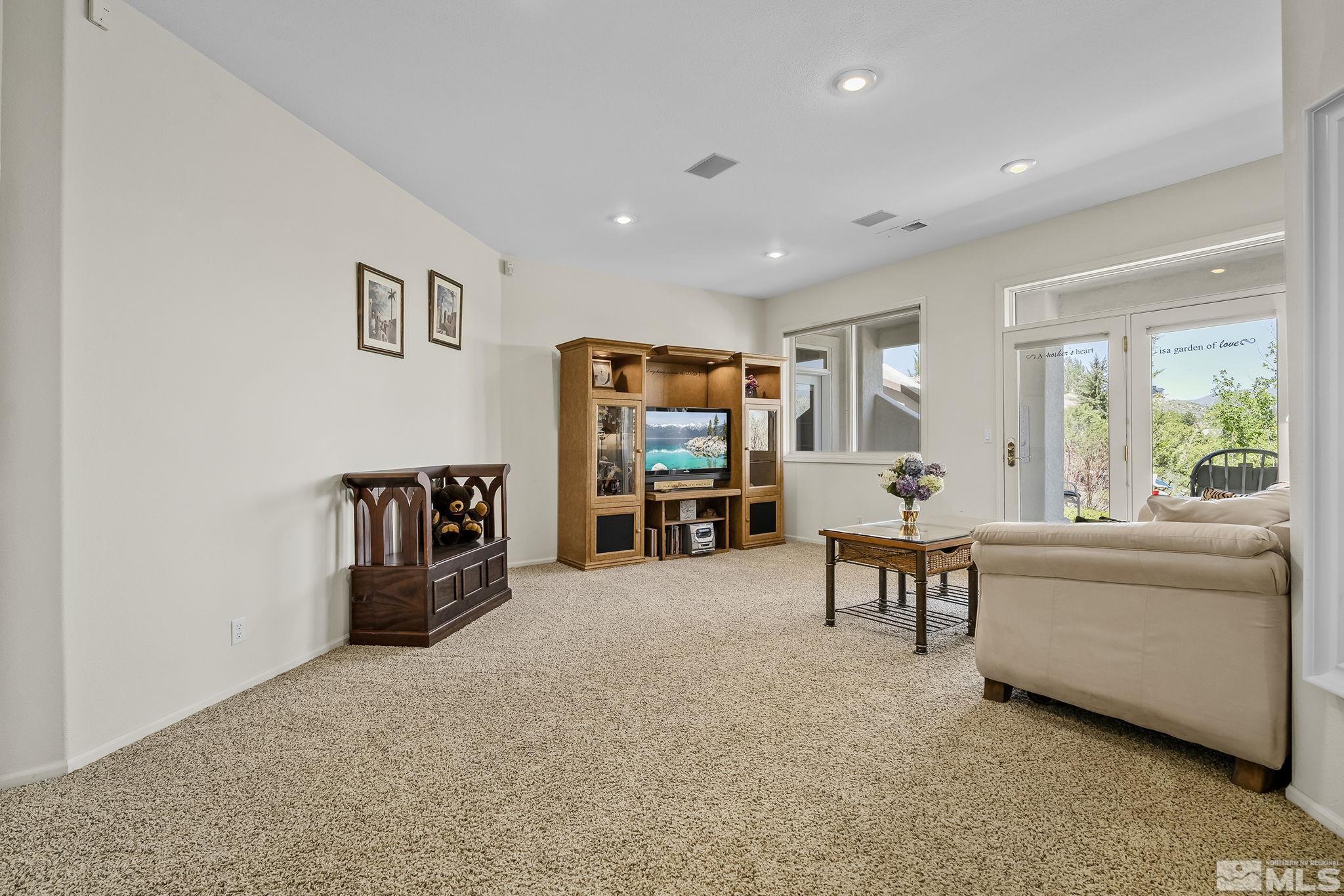 29 Sawbuck Road Reno, NV 89519 - Photo 26 of 40 a living room with furniture and a flat screen tv