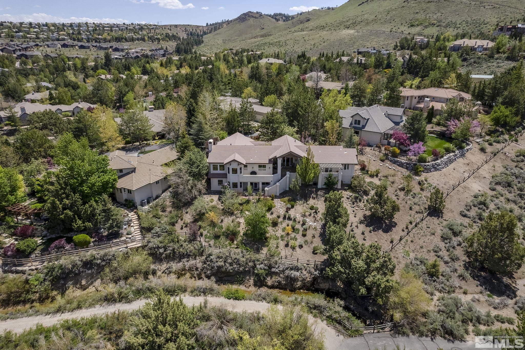 29 Sawbuck Road Reno, NV 89519 - Photo 33 of 40 an aerial view of residential house with parking space and mountain view in back