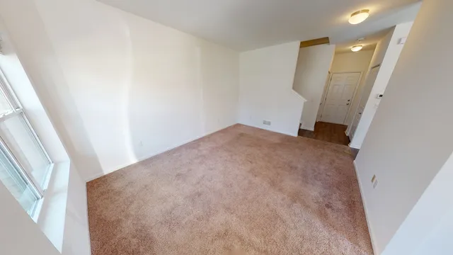 a view of a big room with closet and mirror