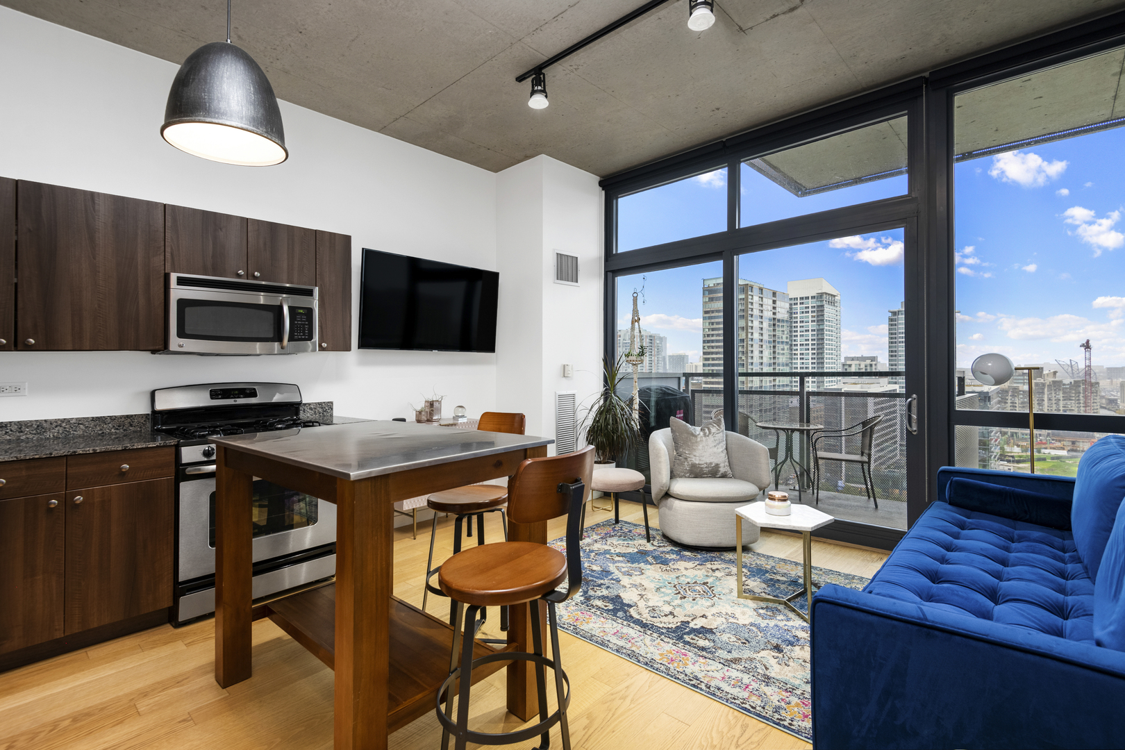 235 West Van Buren Street, Unit 2009 Chicago, IL 60607 - Photo 5 of 14 a living room with furniture and a flat screen tv