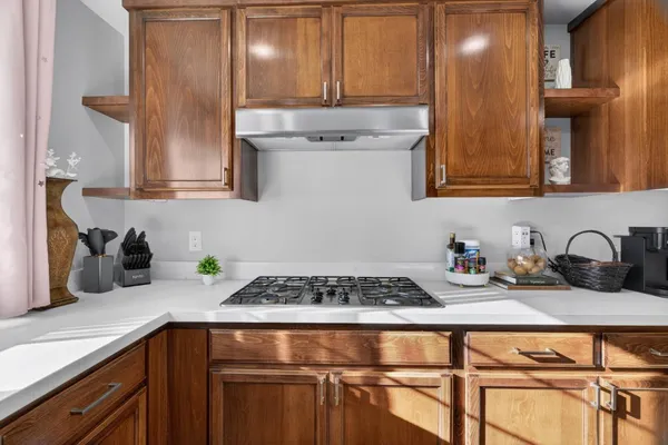 a kitchen with sink and cabinets