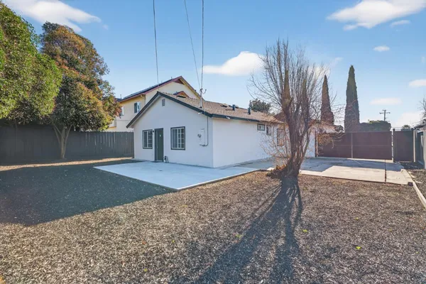 a house view with a backyard space