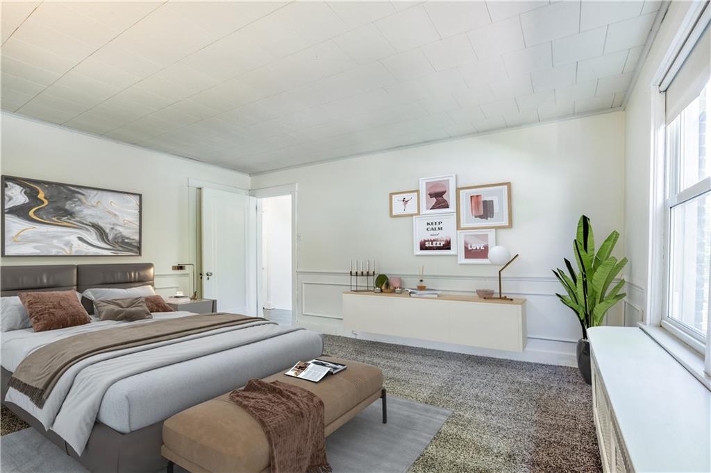 6418 Landview Road Pittsburgh, PA 15217 - Photo 11 of 24 a bedroom with a large bed couch and a potted plant