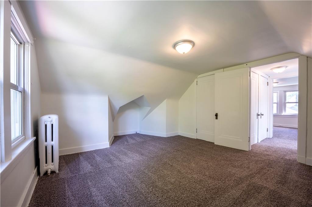 6418 Landview Road Pittsburgh, PA 15217 - Photo 14 of 24 an empty room with entrance and windows