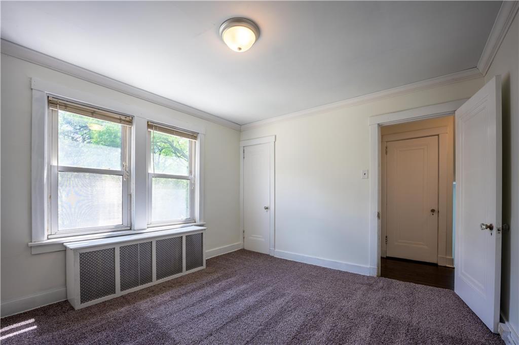 6418 Landview Road Pittsburgh, PA 15217 - Photo 15 of 24 an empty room with windows and closet