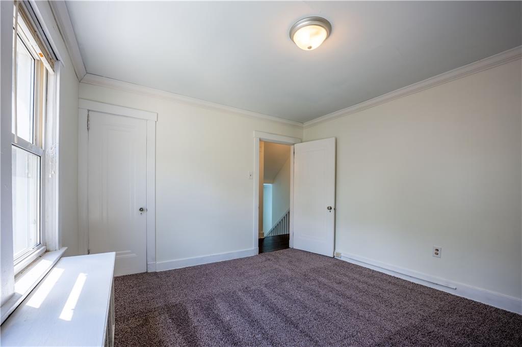 6418 Landview Road Pittsburgh, PA 15217 - Photo 16 of 24 an empty room with windows and closet