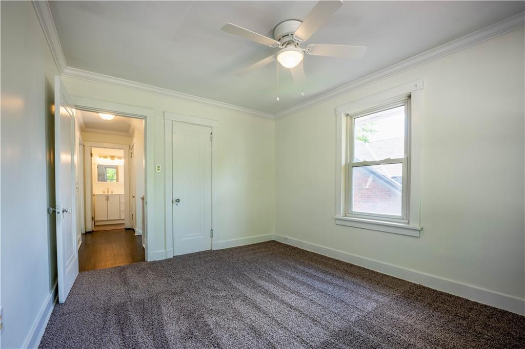 6418 Landview Road Pittsburgh, PA 15217 - Photo 19 of 24 an empty room with windows and fan