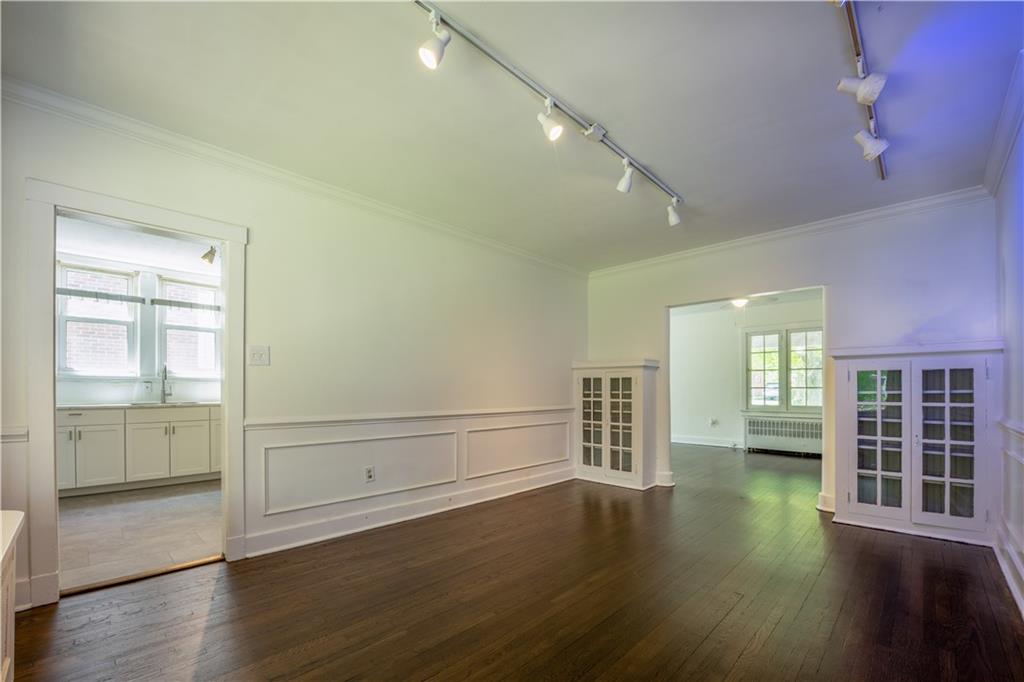 6418 Landview Road Pittsburgh, PA 15217 - Photo 7 of 24 an empty room with wooden floor and windows