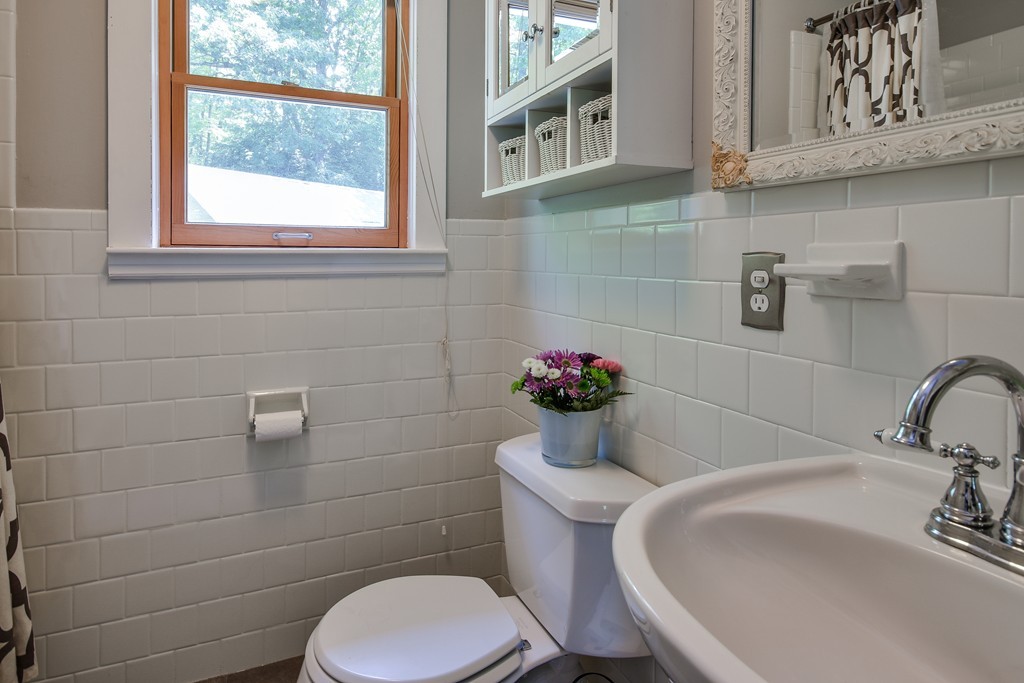 128 Hudson Road Bolton, MA 01740 - Photo 12 of 21 a bathroom with a sink and a toilet