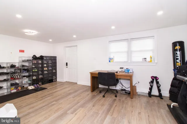 a workspace with furniture and wooden floor