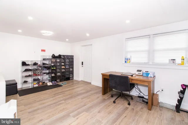 a workspace with furniture and wooden floor