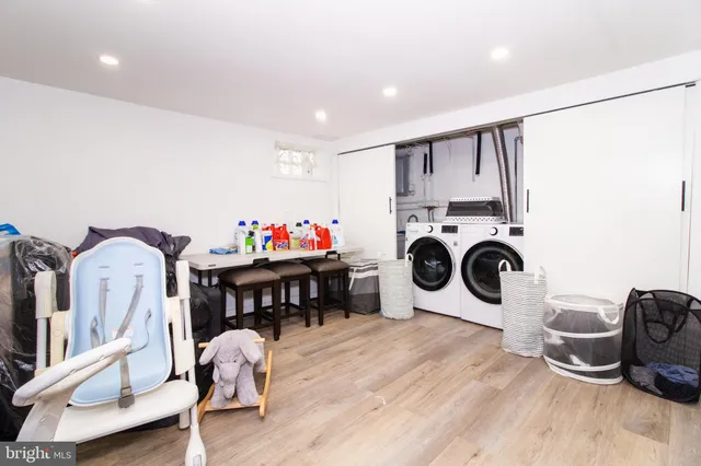 a view of dining room with furniture and wooden floor