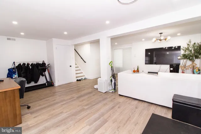 a room with furniture and a flat screen tv