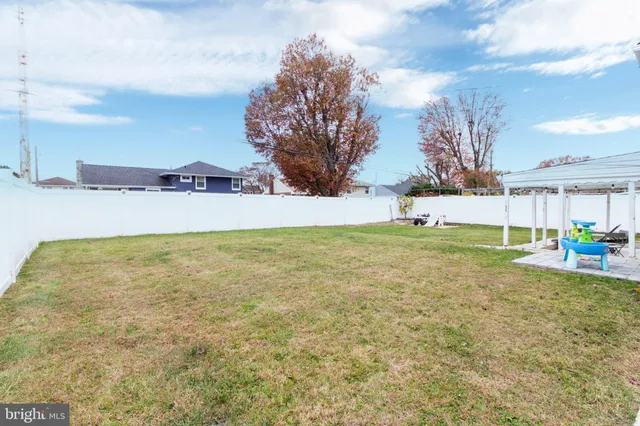 a view of an outdoor space and basketball court