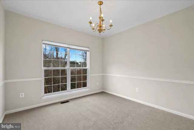 a view of empty room with windows