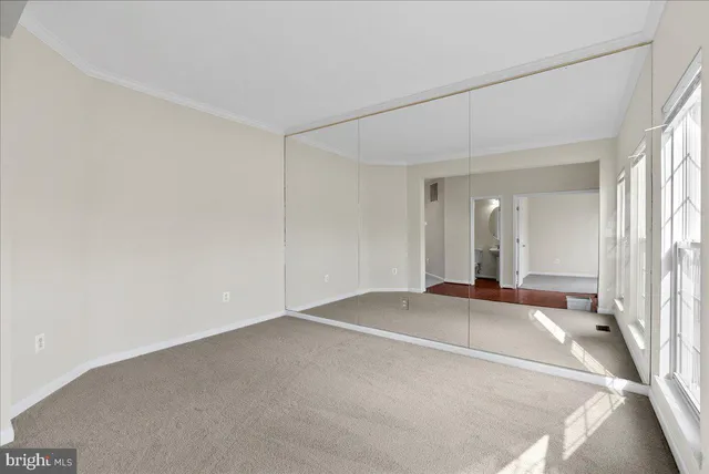 a view of an empty room with a fireplace