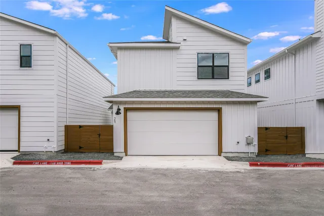 a front view of a house with garage