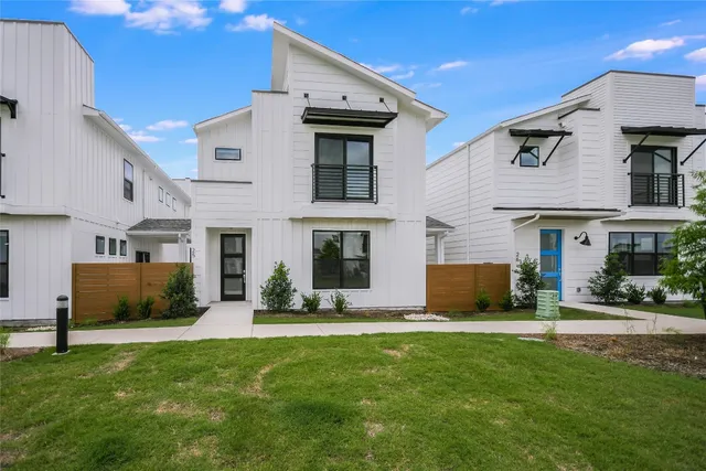 a front view of a house with a yard and a fireplace