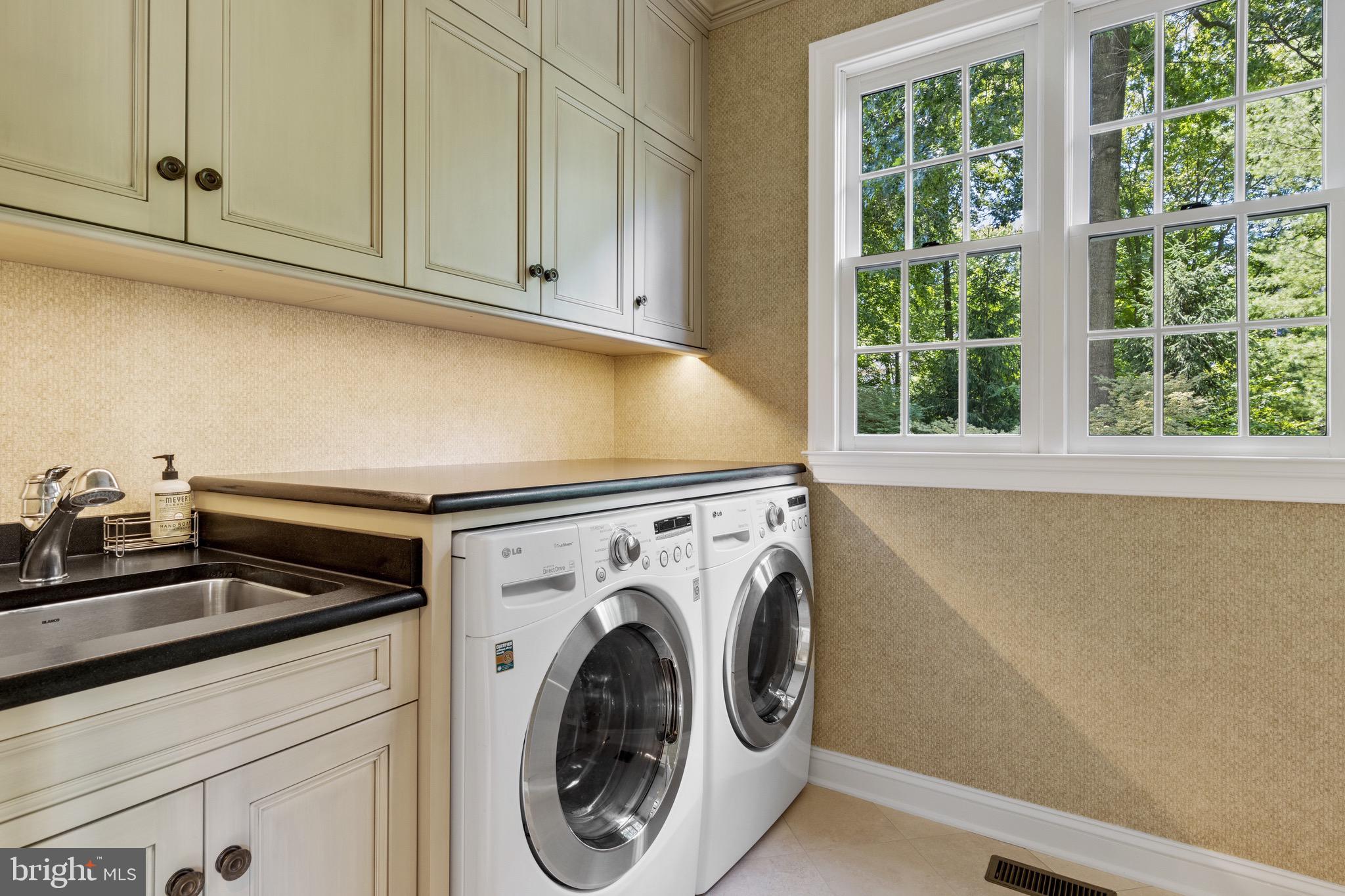 706 Turnbridge Road Wayne, PA 19087 - Photo 35 of 72 Laundry with custom cabinets and granite tops