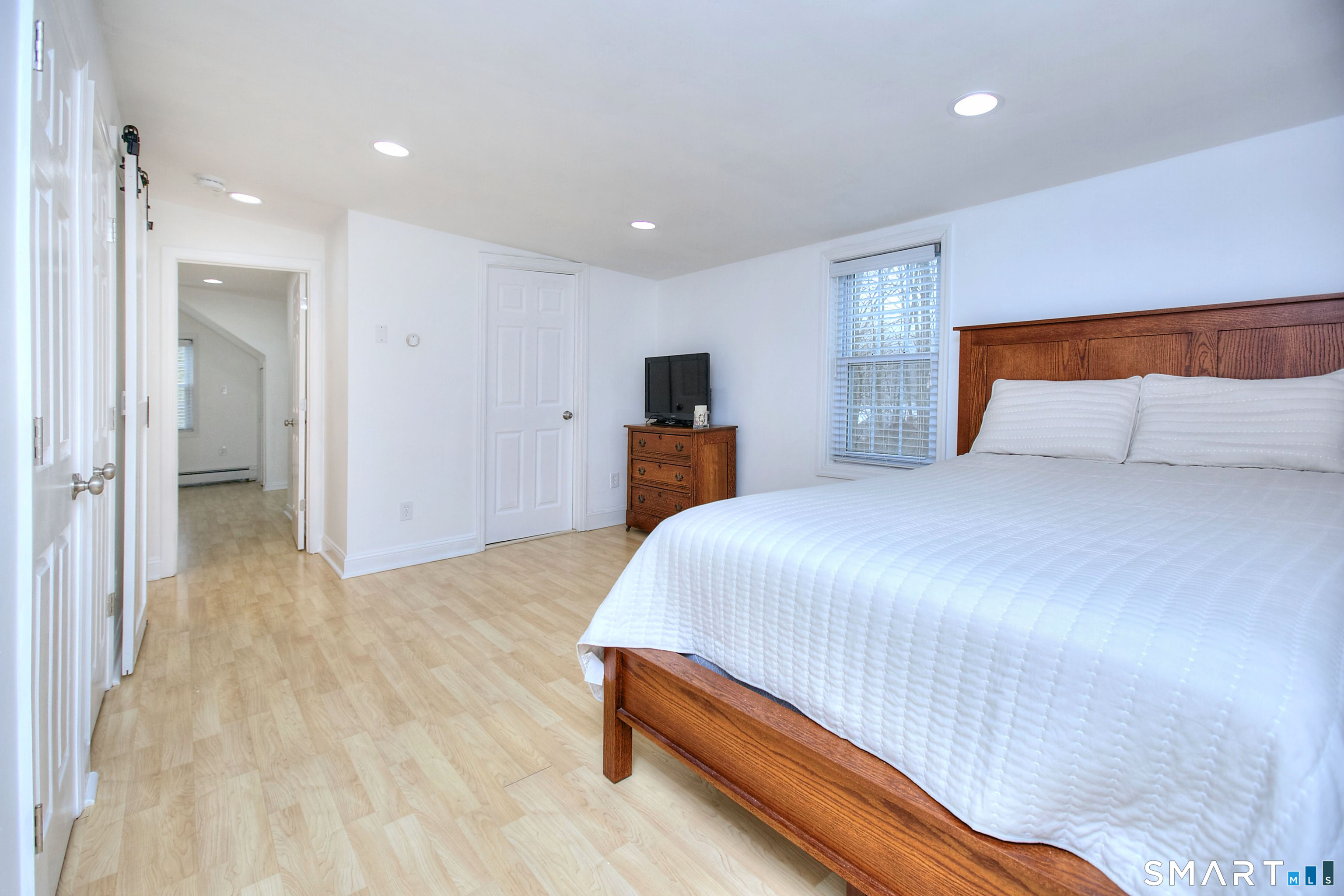 46 Crest Road Ridgefield, CT 06877 - Photo 20 of 41 a bedroom with a bed and a dresser