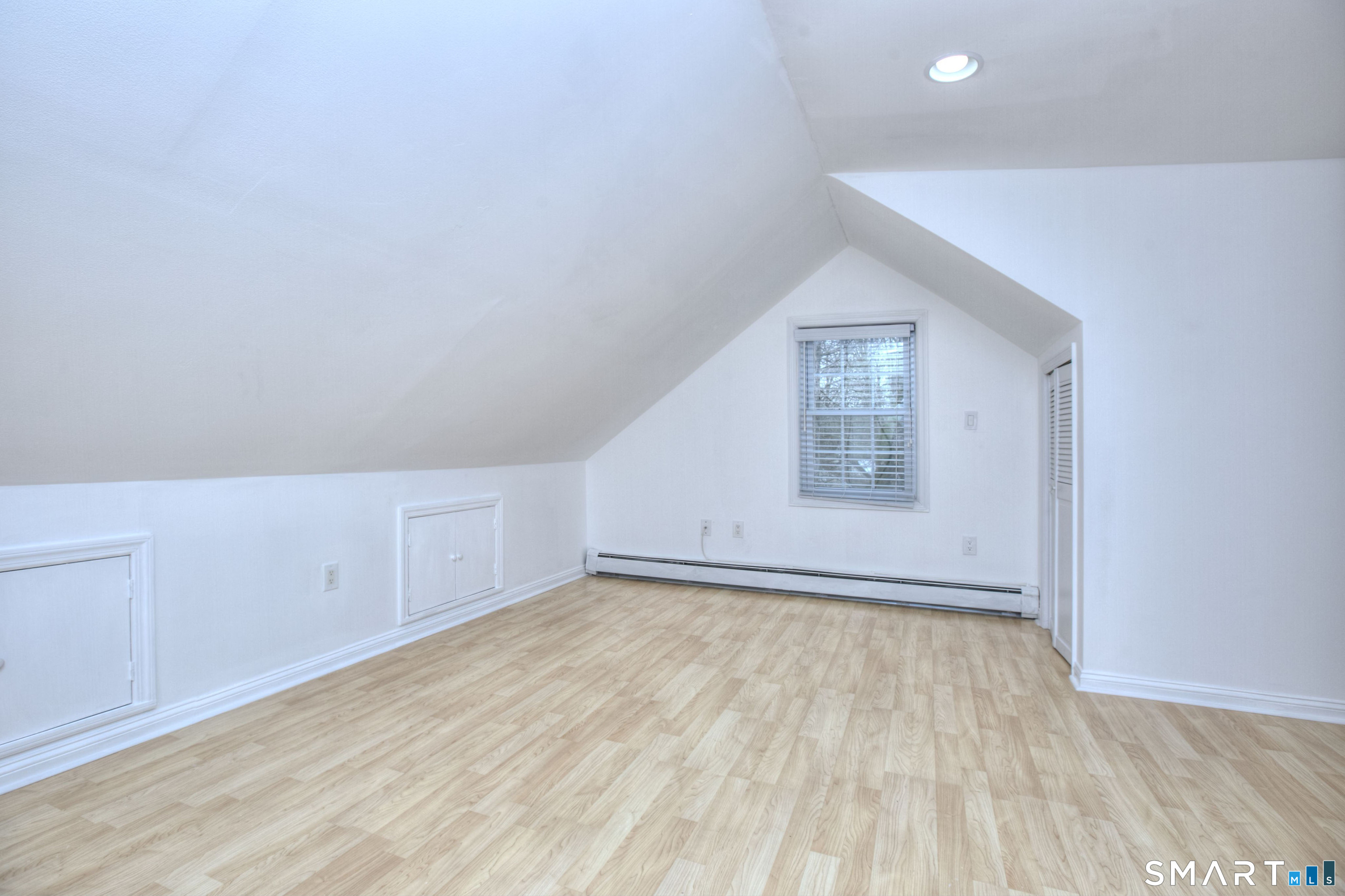 46 Crest Road Ridgefield, CT 06877 - Photo 24 of 41 a view of an empty room with wooden floor and a window