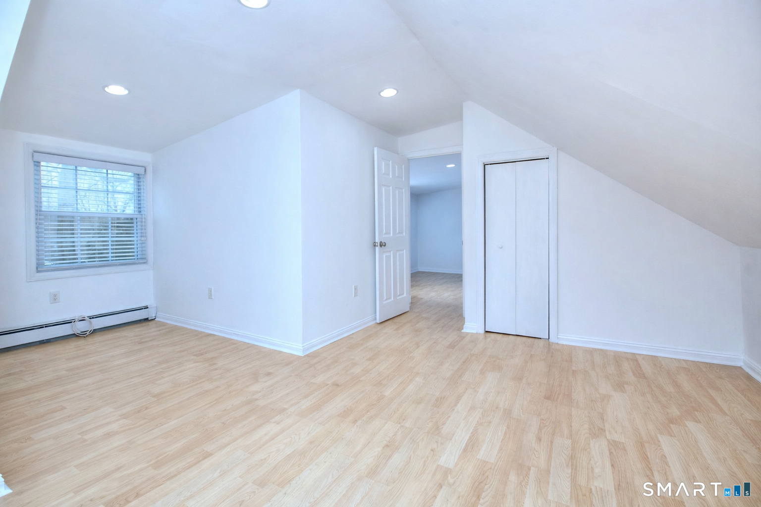46 Crest Road Ridgefield, CT 06877 - Photo 26 of 41 a view of an empty room with wooden floor and a window