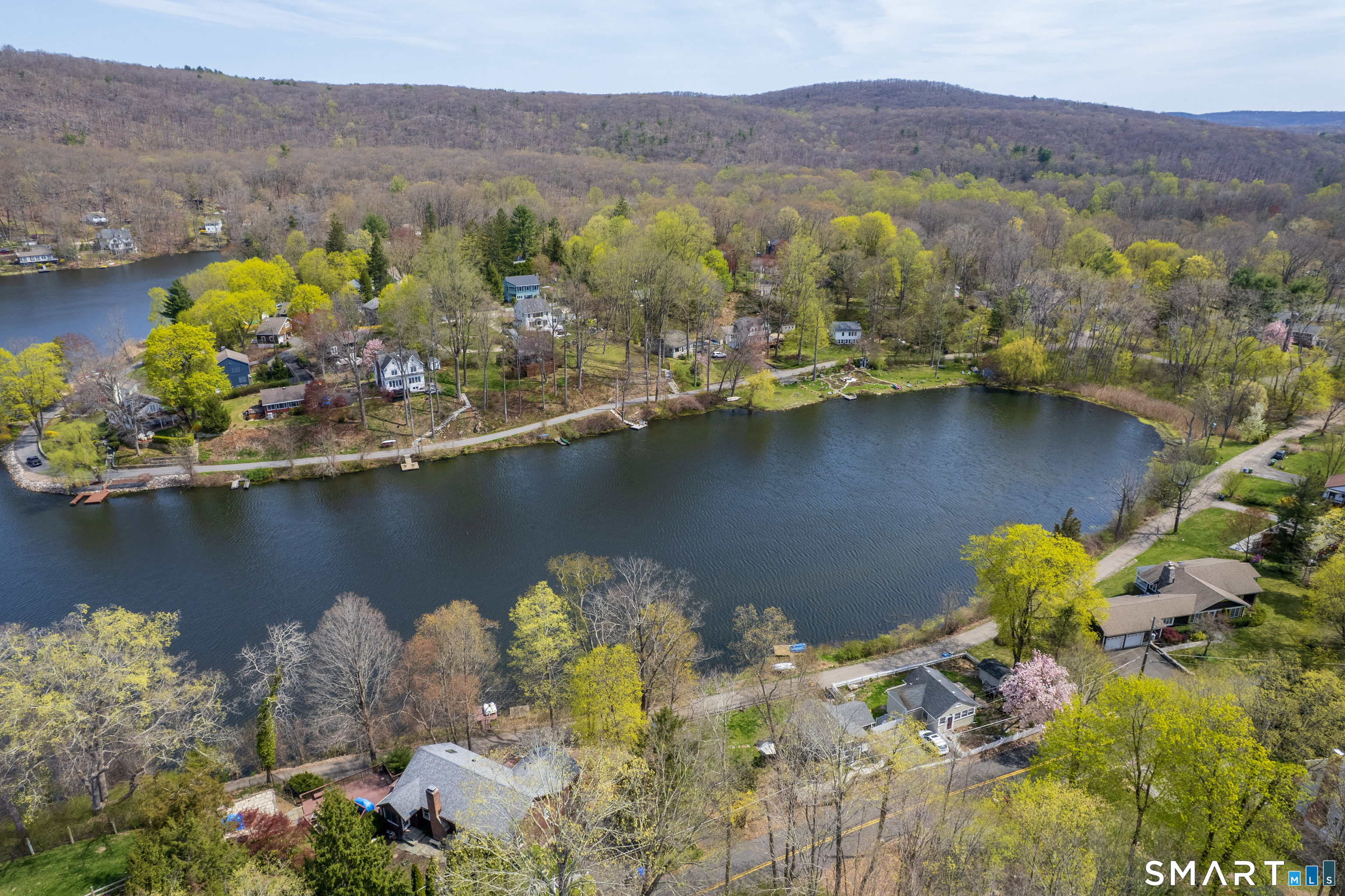 46 Crest Road Ridgefield, CT 06877 - Photo 40 of 41 a view of a lake with mountains in the background