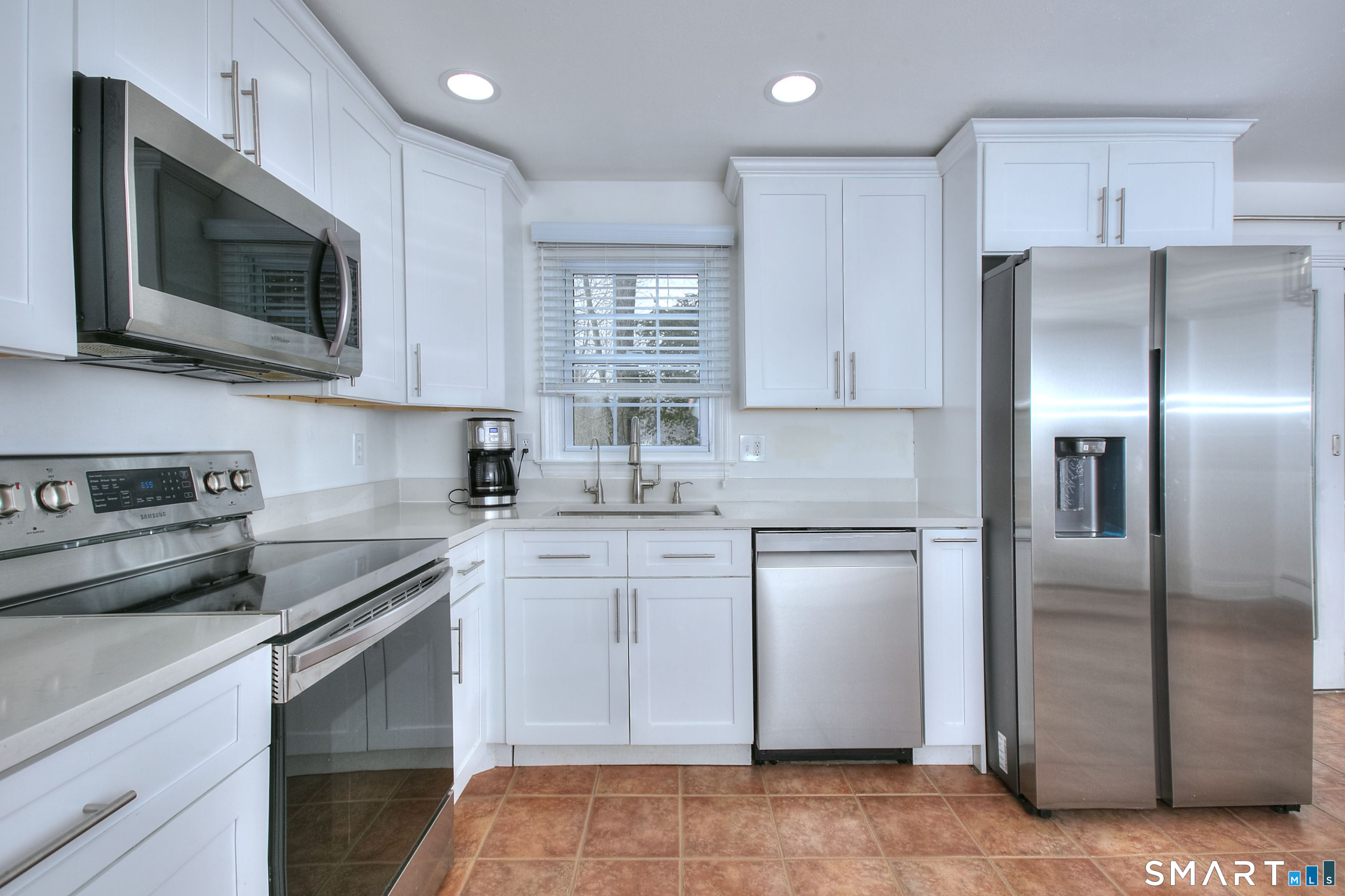 46 Crest Road Ridgefield, CT 06877 - Photo 10 of 41 a kitchen with a refrigerator stove and microwave