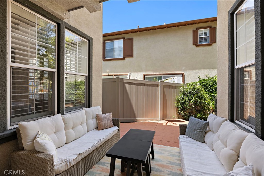 71 Sklar Street Ladera Ranch, CA 92694 - Photo 4 of 55 a living room with furniture and a large window