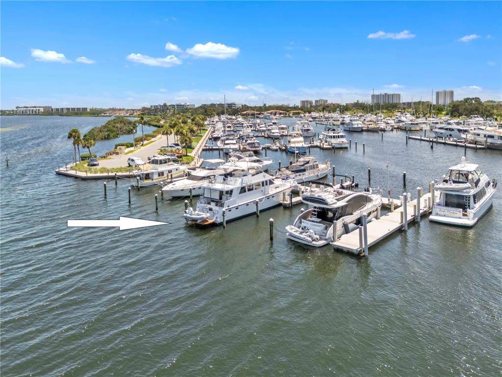 2600 Harbourside Drive, Unit R9 Longboat Key, FL 34228 - Photo 3 of 26 a view of a lake with boats and trees