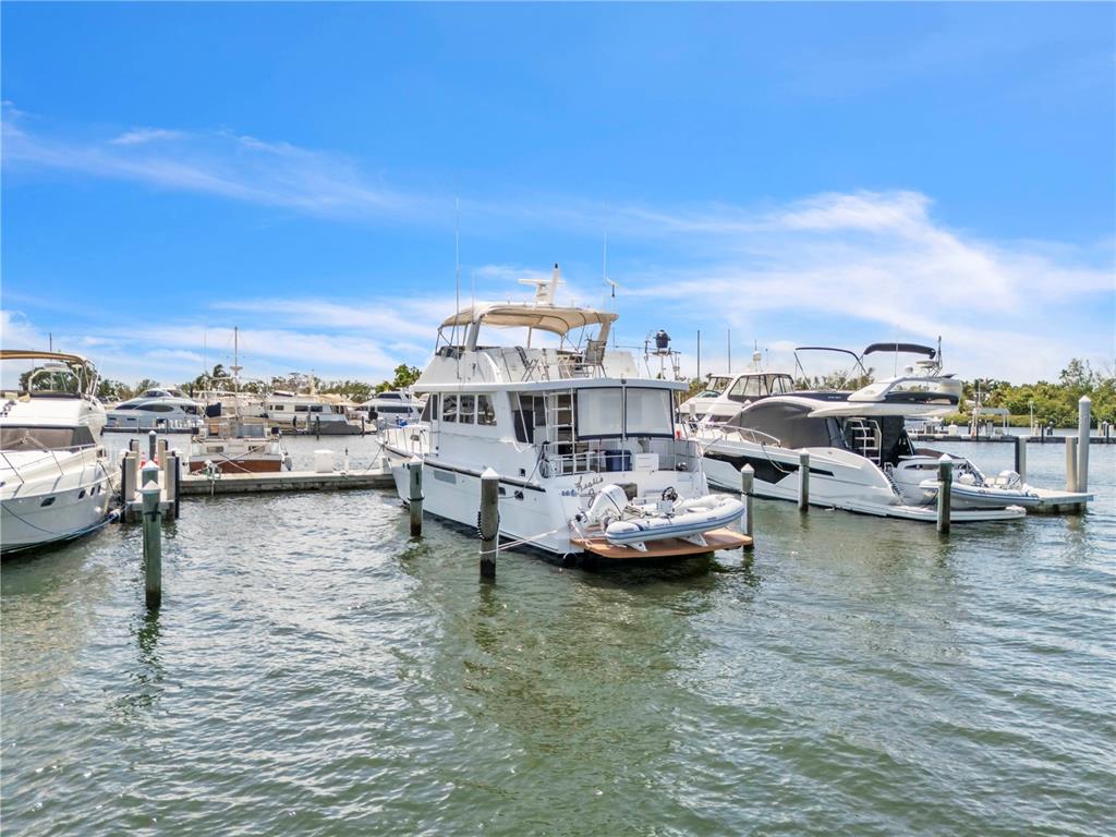 2600 Harbourside Drive, Unit R9 Longboat Key, FL 34228 - Photo 4 of 26 a view of ocean with boats and trees in the background
