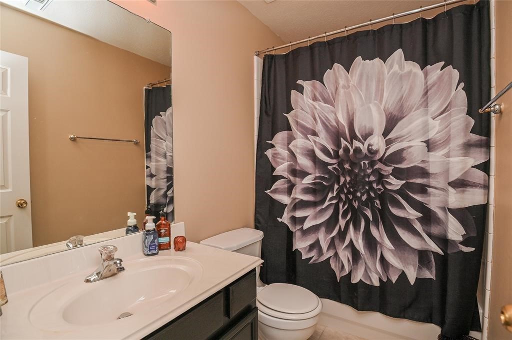 18446 South Wimbledon Drive Katy, TX 77449 - Photo 24 of 24 a bathroom with a sink toilet and shower