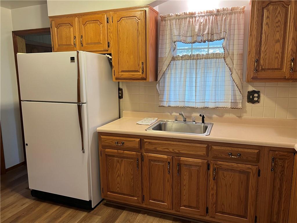 4341 Highway 66 Apollo, PA 15613 - Photo 4 of 21 a white refrigerator freezer sitting inside of a kitchen
