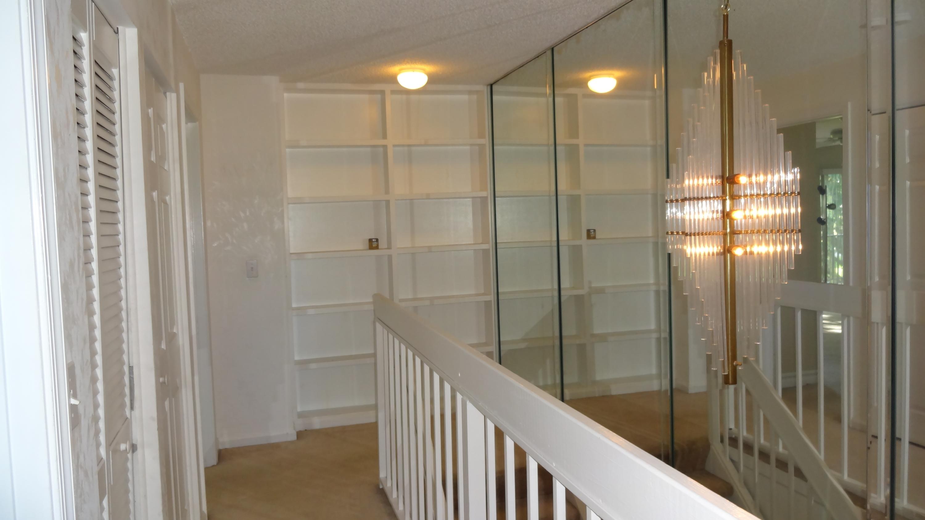 454 Ashwood Place Boca Raton, FL 33431 - Photo 12 of 26 2nd floor built-in book shelves