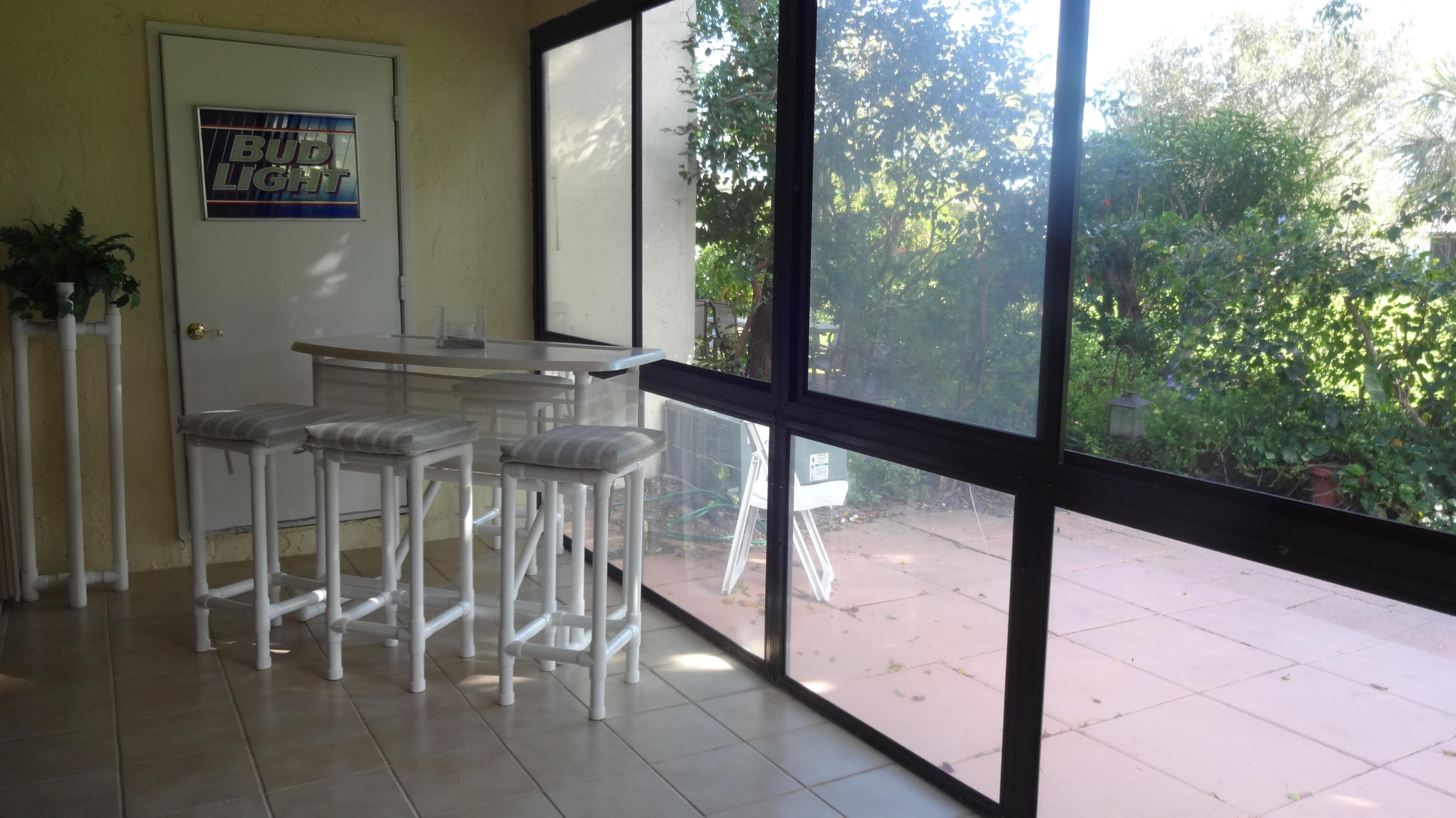 454 Ashwood Place Boca Raton, FL 33431 - Photo 24 of 26 screened/covered patio