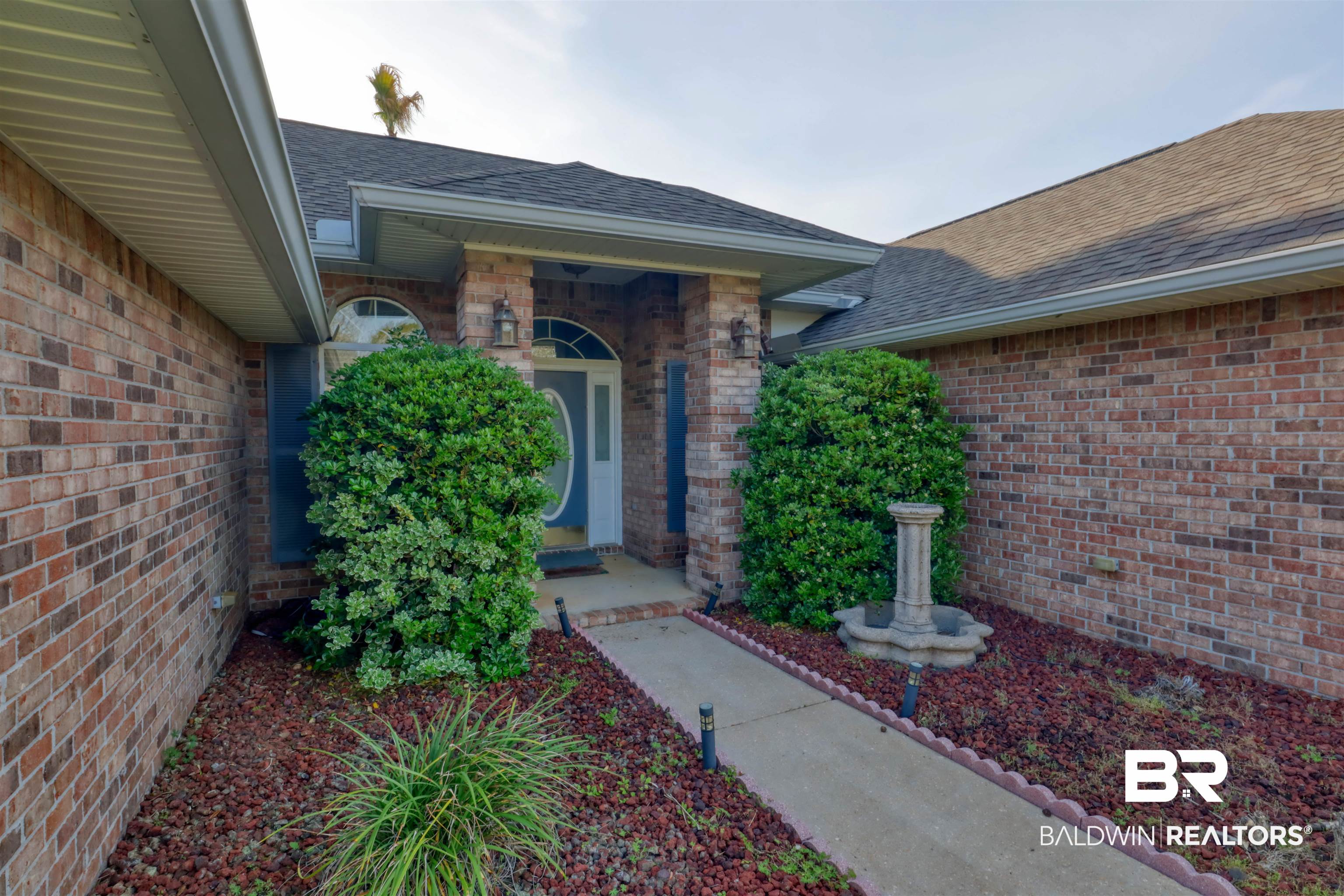 12893 Hunters Chase Foley, AL 36535 - Photo 42 of 42 Entrance to property featuring a shingled roof and brick siding