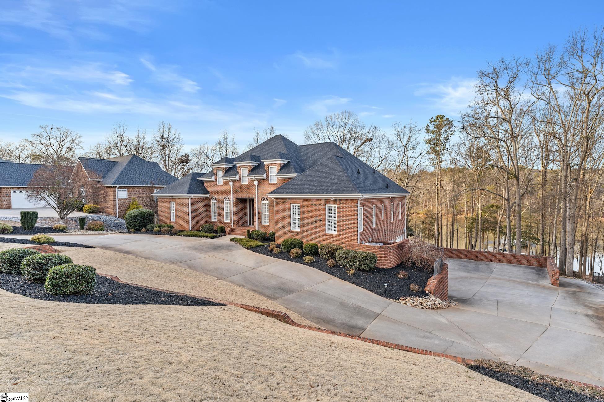 112 P-9-45 Anderson, SC 29625 - Photo 1 of 36 Large driveway leading to basement 3-car garage. Extensive Professional Landscaping with bermuda grass.