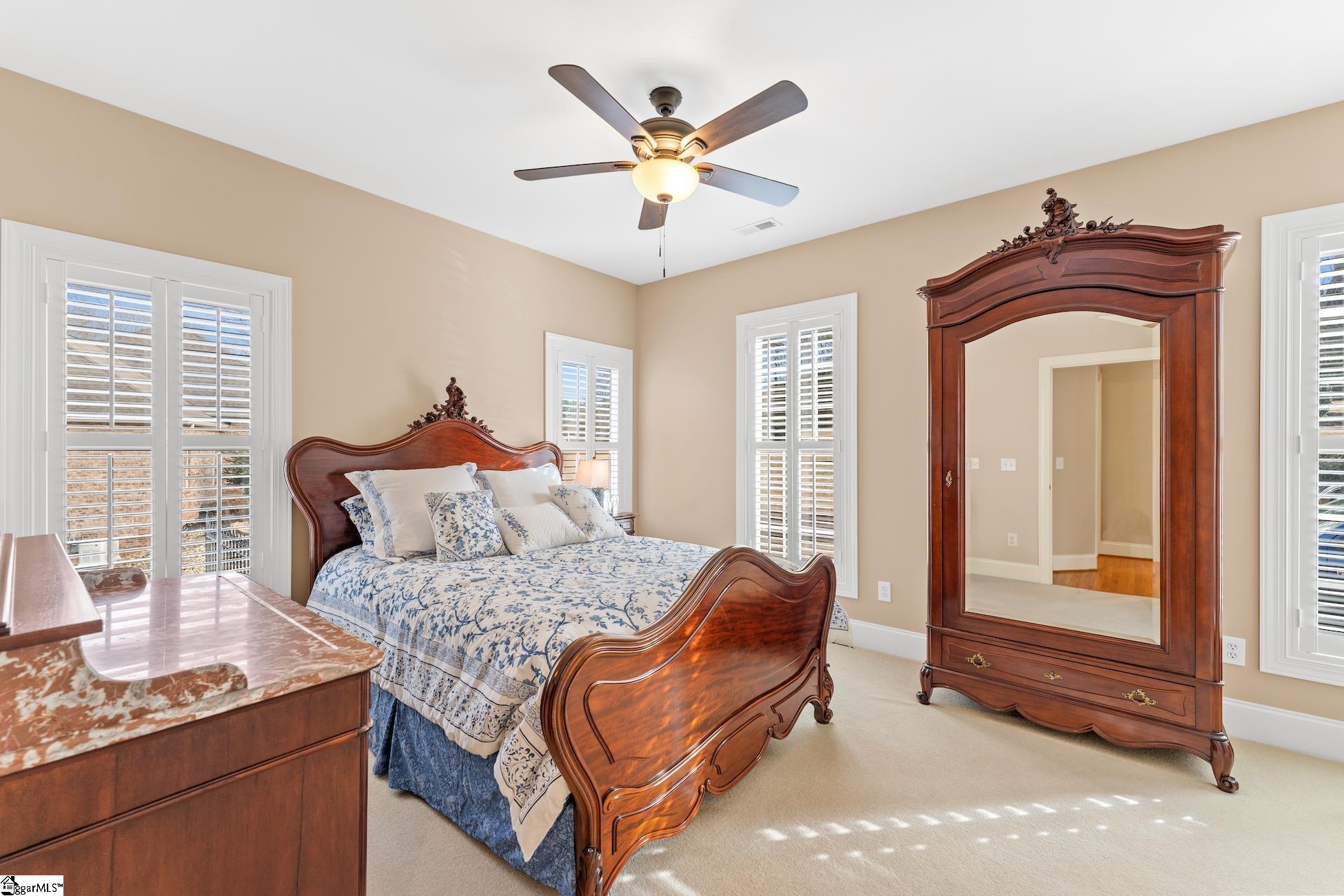112 P-9-45 Anderson, SC 29625 - Photo 14 of 36 Bright bedroom with multiple windows, carpet flooring, ceiling fan and jack-n-jill bath.