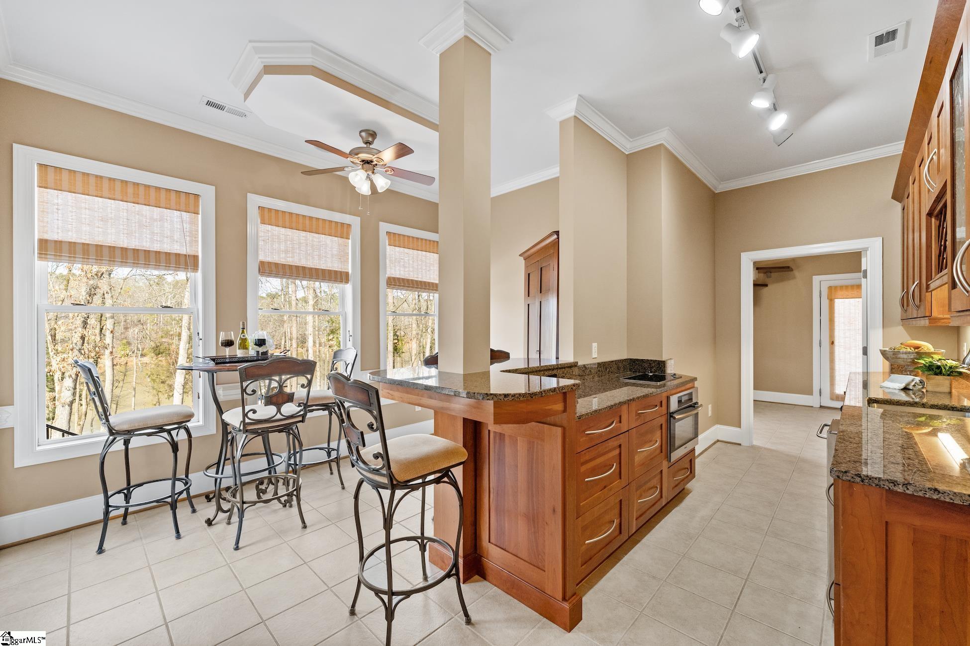 112 P-9-45 Anderson, SC 29625 - Photo 21 of 36 Basement kitchen and dining area with lake views.