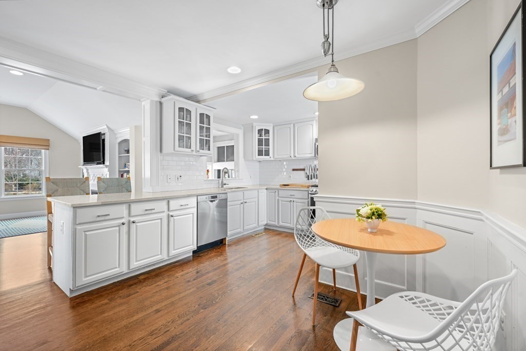 19 Elmwood Road Wellesley, MA 02481 - Photo 15 of 41 a kitchen with stainless steel appliances a dining table chairs and wooden floor