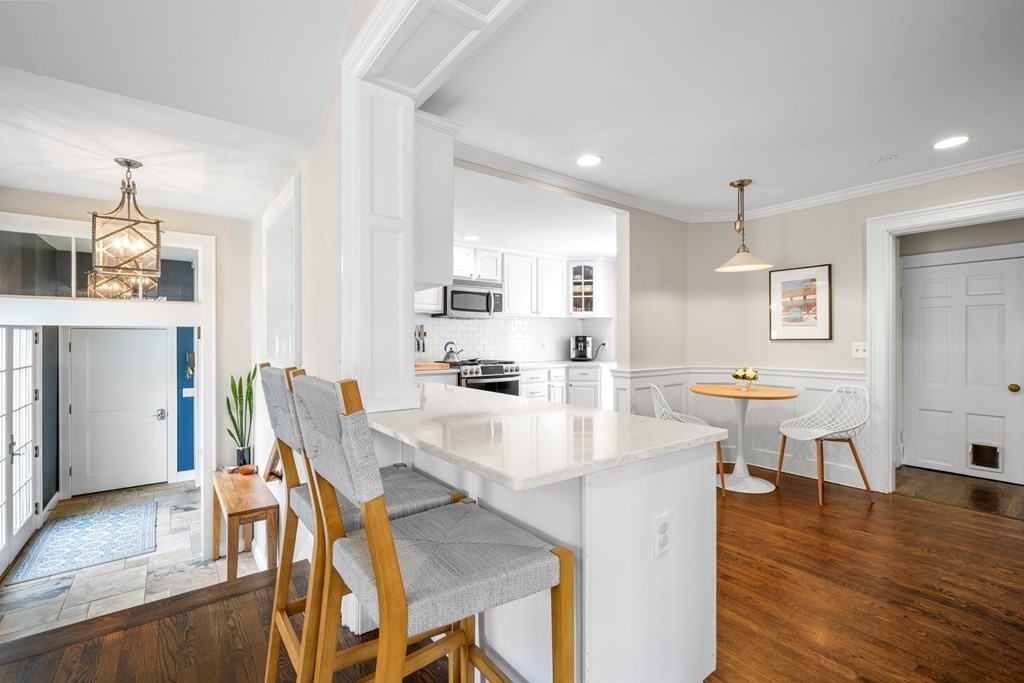 19 Elmwood Road Wellesley, MA 02481 - Photo 16 of 41 a view of kitchen with cabinets and wooden floor