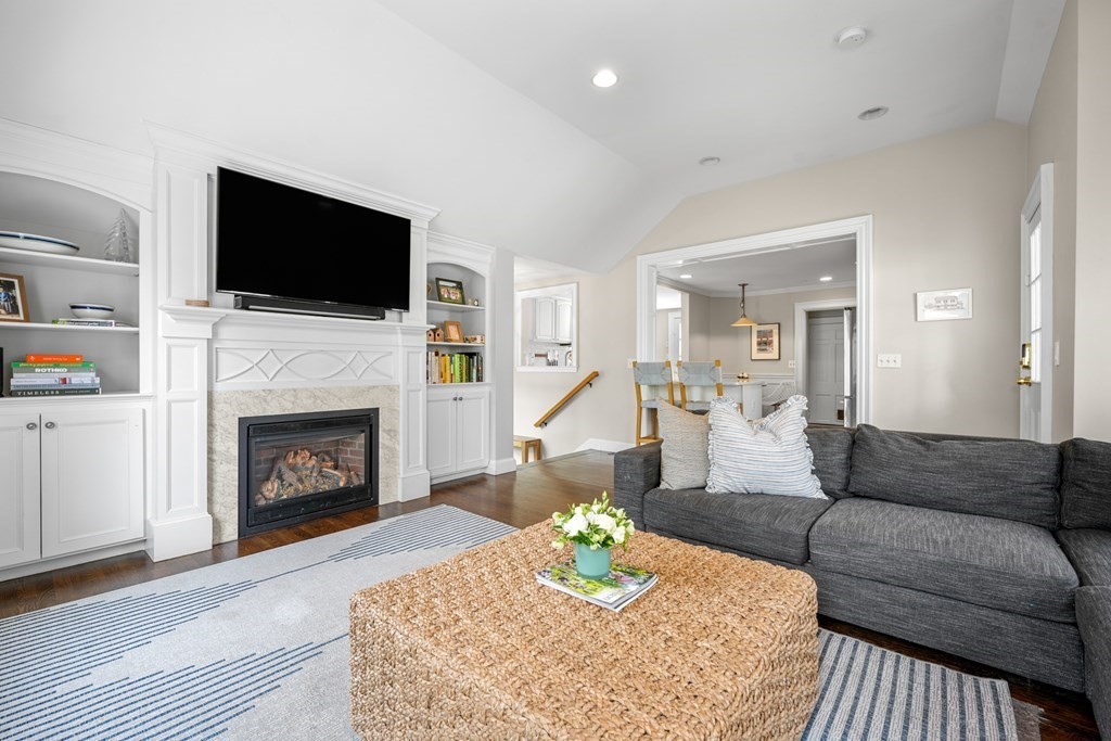 19 Elmwood Road Wellesley, MA 02481 - Photo 18 of 41 a living room with furniture a flat screen tv and a fireplace