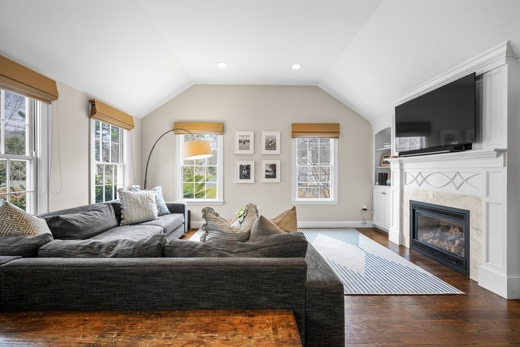 19 Elmwood Road Wellesley, MA 02481 - Photo 20 of 41 a living room with fireplace furniture and a flat screen tv
